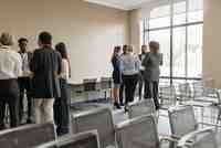 A small group of professionals talking together during a business networking event